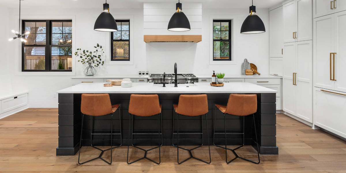 Contemporary kitchen with island and brown stools